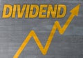 Dividend graph concept on cement texture background Royalty Free Stock Photo