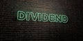 DIVIDEND -Realistic Neon Sign on Brick Wall background - 3D rendered royalty free stock image