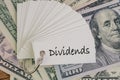 Dividends, return or earning that pay from stock or mutual fund investing concept, lot of paper notes with handwriting word