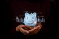 Dividends, savings, interest savings.Investor saving money in piggy bank set future goals Royalty Free Stock Photo