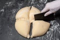 Dividing homemade dough for a Pizza.