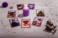 Divination cards alignment for love and family. Candle and wedding rings. Men and women relationships, astrology, fortune telling Royalty Free Stock Photo