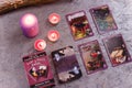 Divination cards alignment with purple burning candle and dry lavender. Mystery, astrology, fortune telling and belief