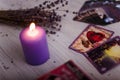 Divination cards alignment with purple burning candle and dry lavender. Mystery, astrology, occultism, fortune telling