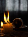 Divination on coffee grounds and a burning candle on an old wooden table Royalty Free Stock Photo