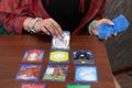 Divination by Tarot cards. The fortune teller predicts the fate of the cards