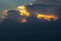 Divine glow through the Clouds of the Evening warm Sun. The Stunning Beauty of a Sunset Royalty Free Stock Photo