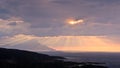 Divine light, stormy sky and sunrise on a landscape around holy mountain Athos