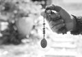 The Divine Mercy devotion concept with a prayer hand holding The Divine Mercy rosary beads with the holy heart of Jesus Christ, Royalty Free Stock Photo