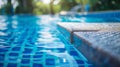 A diving board at the deep end of the pool offers a fun challenge for those looking to test their skills Royalty Free Stock Photo