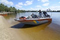 Diving boat with police lifeguards on duty and equipment aboard hits the beach