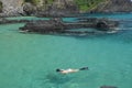 Diving in a crystalline sea beach in Fernando de Noronha Royalty Free Stock Photo