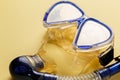 Diving equipment. Snorkeling mask and tube on yellow background. Colorful background. Top view. Copy space Royalty Free Stock Photo