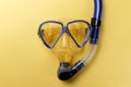 Diving equipment. Snorkeling mask and tube on yellow background. Colorful background. Top view. Copy space Royalty Free Stock Photo