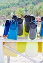 Diving fins arranged on rack Royalty Free Stock Photo