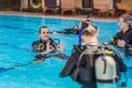 Diving instructor and students. Instructor teaches students to dive Royalty Free Stock Photo