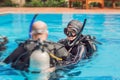 Diving instructor and students. Instructor teaches students to dive Royalty Free Stock Photo