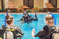Diving instructor and students. Instructor teaches students to dive Royalty Free Stock Photo
