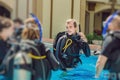 Diving instructor and students. Instructor teaches students to dive Royalty Free Stock Photo