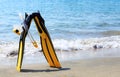 Diving mask, snorkel and fins on a beach Royalty Free Stock Photo