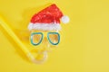 diving set, santa claus hat, sun cream and a bottle of lemonade, Christmas holidays on the beach in a warm country Royalty Free Stock Photo