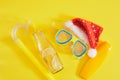 diving set, santa claus hat, sun cream and a bottle of lemonade, Christmas holidays on the beach in a warm country Royalty Free Stock Photo