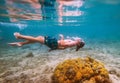 Diving teenage boy snorkeling in underwater glasses making bubbles over the coral reefs underwater photo in the clean turquoise Royalty Free Stock Photo