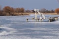 Diving tower in winter. The water is covered with ice Royalty Free Stock Photo