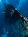 Diving at USAT Liberty Wreck in Tulamben. Freediving in deep sea