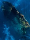 Diving at wreck in Tulamben, Bali. Freediving in deep sea on best diving spot