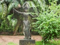 Divinity sculpture in Xieng Khuan Buddha Park Laos surrounded by vegetation