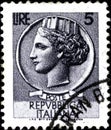 02.09.2020 Divnoe Stavropol Territory Russia the Postage Stamp Italy 1955 Italia - Syracusean Coin Female Porter with Coins Royalty Free Stock Photo