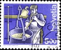 02 11 2020 Divnoe Stavropol Territory Russia postage stamp Switzerland 1993 Trades Occupations Cheesemaker man stirs