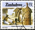 02.11.2020 Divnoe Stavropol Territory Russia the Postage Stamp Zimbabwe 1985 National Infrastructure Woman Crushing Maize