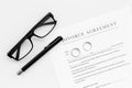 Divorce agreement. Wedding ring on document on white background top view Royalty Free Stock Photo