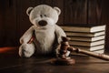 Divorce and alimony concept. Wooden gavel and teddy bear as symbol of child on a desk