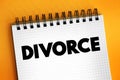 Divorce - canceling or reorganizing of the legal duties and responsibilities of marriage, text concept on notepad Royalty Free Stock Photo