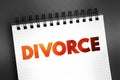 Divorce - canceling or reorganizing of the legal duties and responsibilities of marriage, text on notepad, concept background Royalty Free Stock Photo