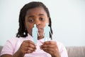 Divorce Concept. Sad Girl Holding Parents Paper Figures In Hands