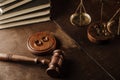 Divorce concept. Wooden gavel and rings on a desk Royalty Free Stock Photo