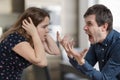Divorce concept. Young angry couple arguing and shouting. Royalty Free Stock Photo