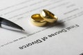 Divorce decree form with marriage ring and pen Royalty Free Stock Photo