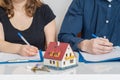 Divorce and dividing a property concept. Man and woman are signing divorce agreement Royalty Free Stock Photo