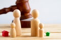 Divorse property division concept. Wooden family with house and judge gavel Royalty Free Stock Photo