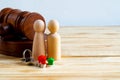 Divorse property division concept. Wooden family with house and judge gavel Royalty Free Stock Photo