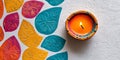 Diwali background featuring a single diya and vibrant patterns Royalty Free Stock Photo