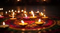 Diwali celebration - Diya oil lamps lit on colorful rangoli, generative ai Royalty Free Stock Photo