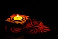 Diwali decoration with traditional clay lamps and rangoli on dark background. diwali concept