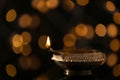 Diwali diya or clay lamp against lights