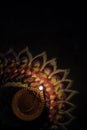 Diwali diya colorful rangoli design with dark background